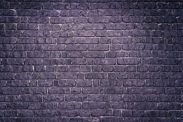 难看的东西紫罗兰色的混凝土墙模仿砖砌的背景