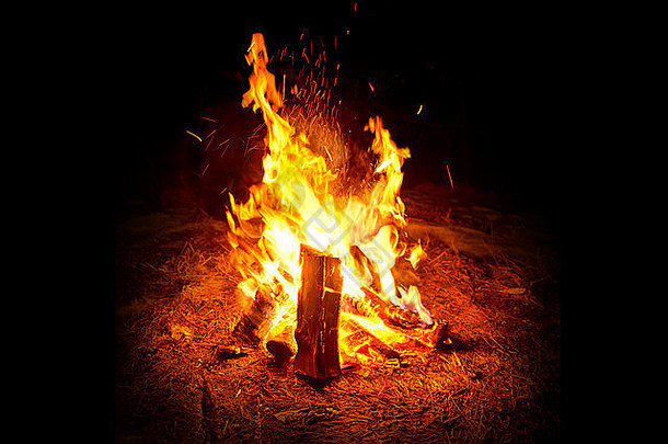 野营火温暖的发光的营火晚上