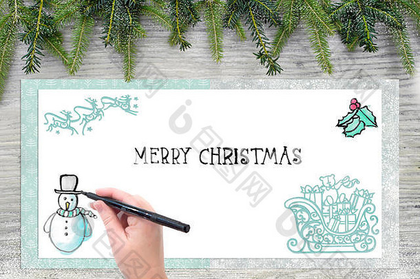 女人的手吸引了圣诞节插图英语文本快乐圣诞节购物背景木冷杉绿色