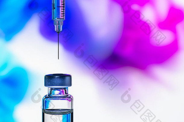 注射器针点疫苗瓶色彩斑斓的摘要背景