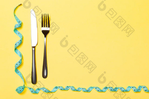 叉刀卷磁带测量黄色的背景前视图软件软件饮食概念空间设计