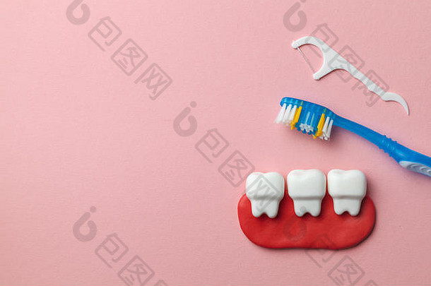 健康的白色牙齿粉红色的背景牙刷牙科牙线复制空间文本