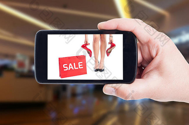 出售广告女人鞋子概念电话屏幕购物中心背景
