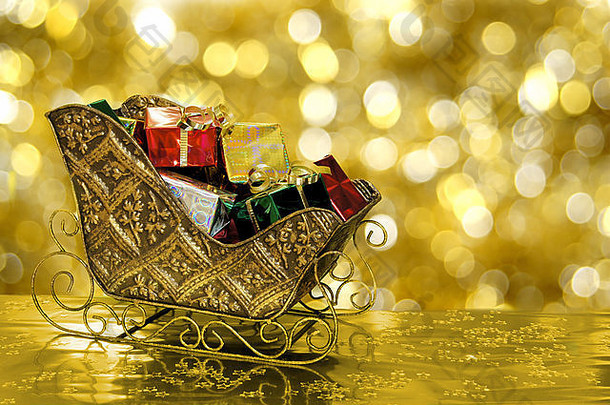 圣诞节雪橇雪橇填满<strong>礼物</strong>盒子黄金背景