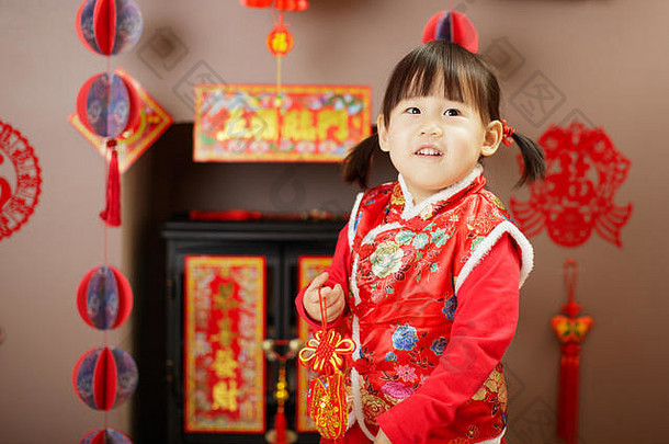 中国人婴儿女孩传统的沙拉酱庆祝中国人一年种类意味着幸运的点缀问候卡背景