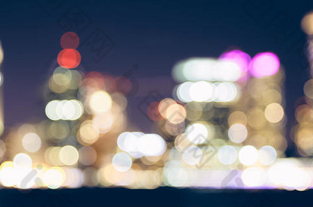 颜色健美的模糊城市灯晚上城市摘要背景