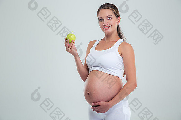 肖像快乐怀孕了女人持有<strong>苹果</strong>孤立的白色背景相机