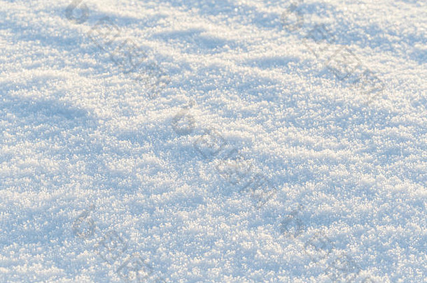特写镜头新鲜的雪地面阳光明媚的一天好冬天季节背景