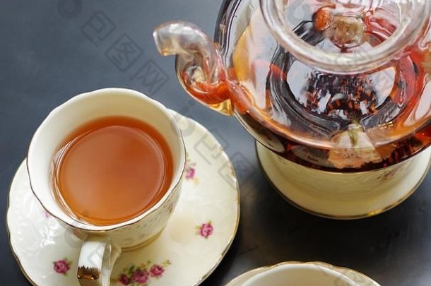 黑色的茶枸中国人枸杞子茉莉花玻璃茶壶瓷杯花模式碟子黑色的表格