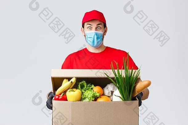 食品杂货包交付科维德检疫购物概念惊讶快递红色的统一的脸面具手套深刻的印象持有