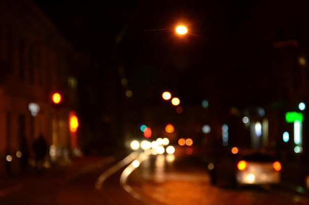 模糊晚上场景交通巷道散焦图像汽车旅行发光的头灯散景艺术