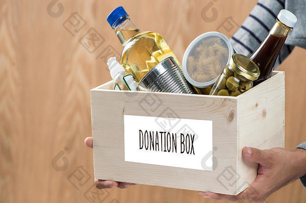 志愿者捐赠盒子食物东西木背景