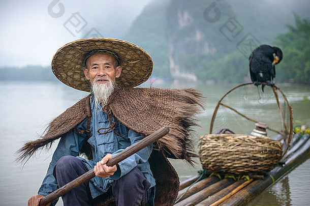 贪婪的人渔夫鸟河yangshuo广西中国