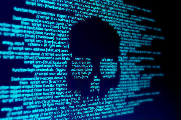 电脑代码屏幕头骨代表电脑病毒恶意软件攻击