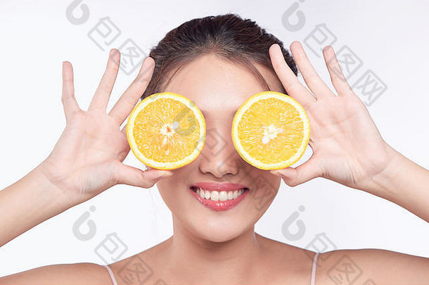 年轻的亚洲女人橙色手孤立的白色背景
