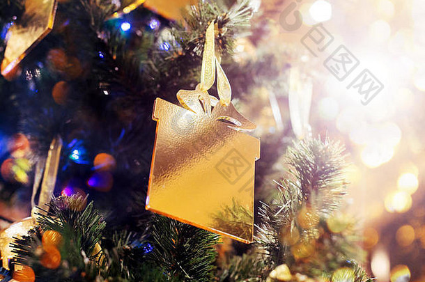 圣诞节一年发光的背景假期装饰黄金De-focused灯装饰树