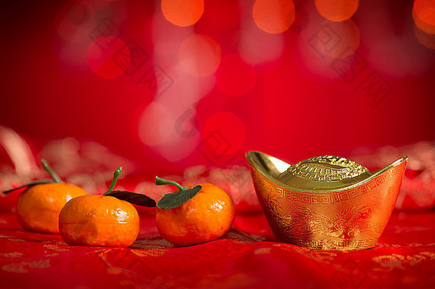 中国人一年节日装饰黄金锭普通话橙色红色的闪闪发光的背景