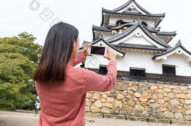 女人采取照片彦根城城堡
