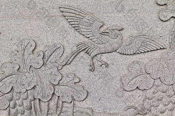 鸟雕刻石头墙中国人寺庙泰国