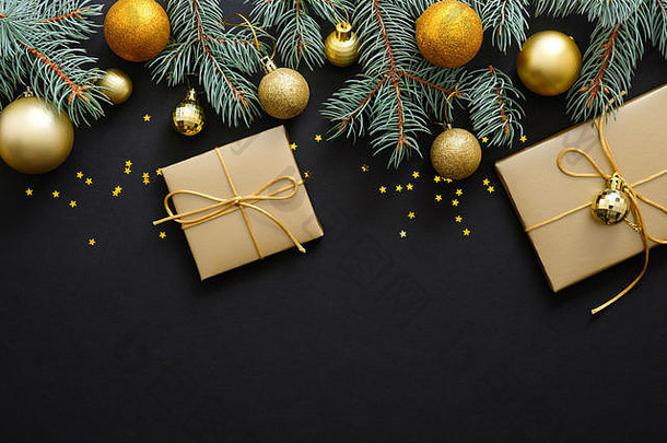 圣诞节作文金装饰物现代节日装饰礼物盒子冷杉树分支机构黑暗黑色的背景优雅的圣诞节问候