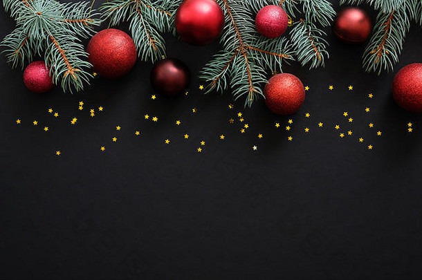 圣诞节黑暗黑色的背景红色的装饰物圣诞节装饰冷杉树分支机构五彩纸屑明星圣诞节框架边境前视图复制空间