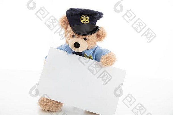 警察安全概念可爱的泰迪熊警察官统一的持有空白卡孤立的白色背景复制空间