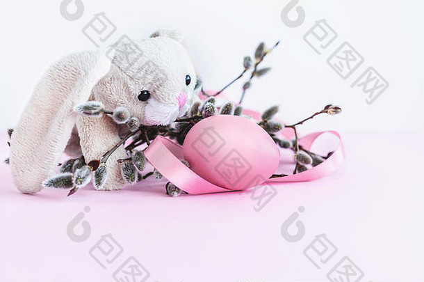 复活节装饰复活节兔子猫咪柳树蛋粉红色的丝带粉红色的背景