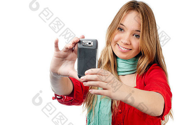 美丽的微笑十几岁的女孩采取<strong>照片</strong>移动电话孤立的白色背景