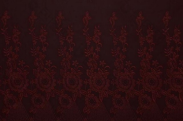 美丽的红色的织物花模式纺织纹理背景