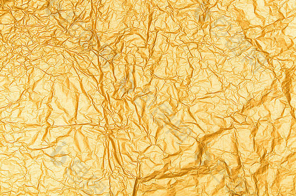 纹理皱巴巴的包装黄金纸背景有皱纹的折叠