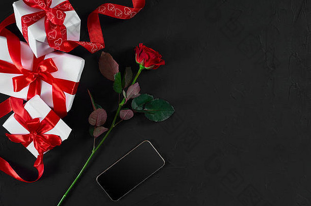 黑暗红色的玫瑰礼物盒子红色的丝带黑色的背气
