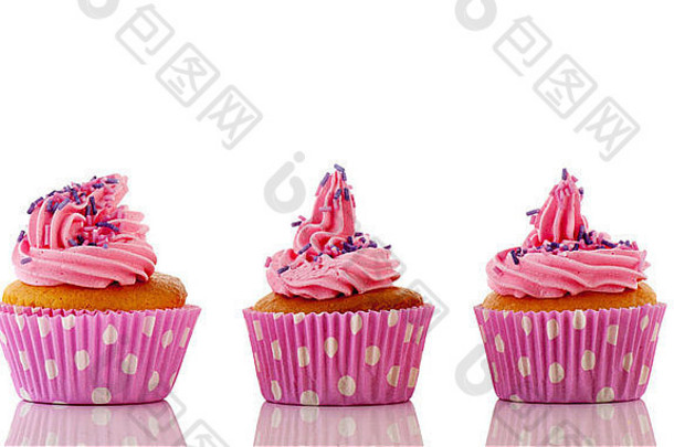 粉红色的纸杯蛋糕紫色的洒玫瑰花