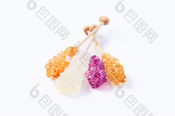岩石糖果橙色白色紫色的糖糖果孤立的白色背景结晶糖毡岩石糖果类型