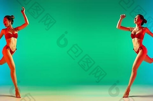 时尚肖像诱人的女孩时尚的泳装绿色背景霓虹灯夏季海滩季节女人运动型身体度假胜地假期假期概念摩天观景轮Copyspace
