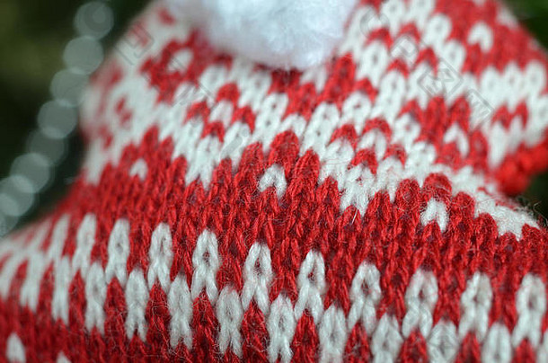 特写镜头红色的白色软针织羊毛织物动机