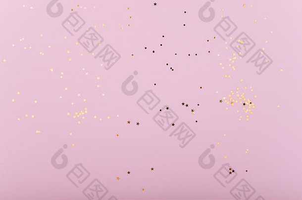 时尚的粉红色的背景黄金亮片星星