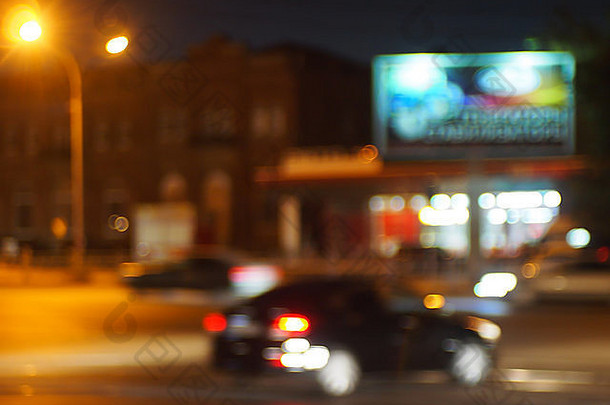 摘要模糊图像车开车城市晚上照明光霓虹灯广告牌