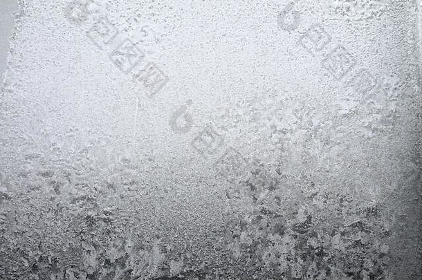 白色窗口玻璃覆盖白霜冰模式纹理冷自然冬天背景