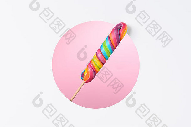 棒棒糖糖果坚持大色彩斑斓的彩虹分层纸设计圆减少粉红色的背景复制空间