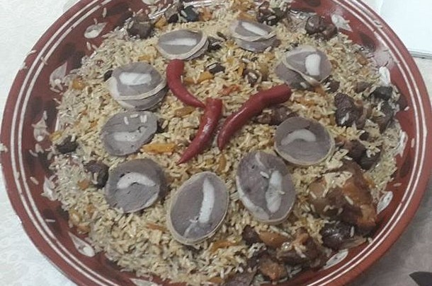 著名的乌兹别克传统的菜时候专业大米黄色的红色的胡萝卜洋葱肉成分临时演员