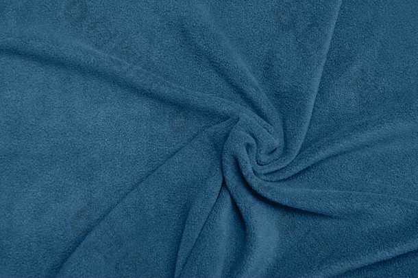 蓝色的羊毛漩涡纺织纹理软触摸模式背景表面关闭时尚的颜色一年