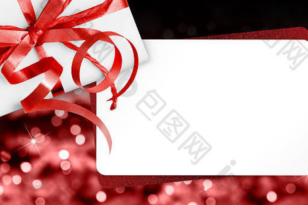 礼物卡片红色的丝带弓孤立的圣诞节明亮的灯背景