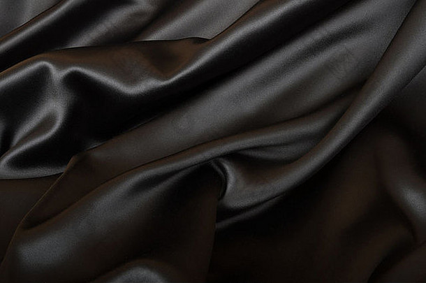 黑色的纹理黑暗波浪光滑的丝绸布料