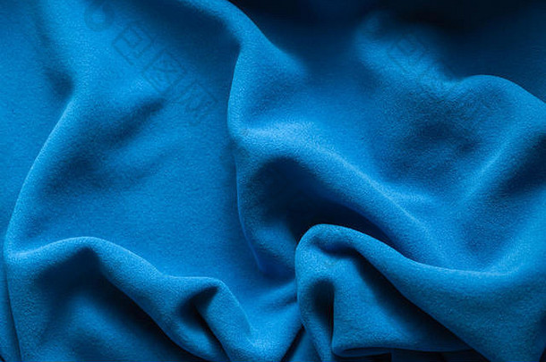 背景纹理蓝色的羊毛软有绒毛的绝缘织物使聚酯波浪模式前视图
