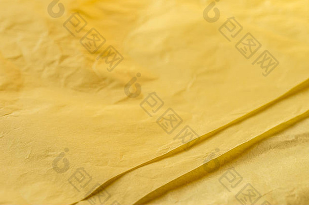 黄色的颜色有皱纹的纸组织背景纹理