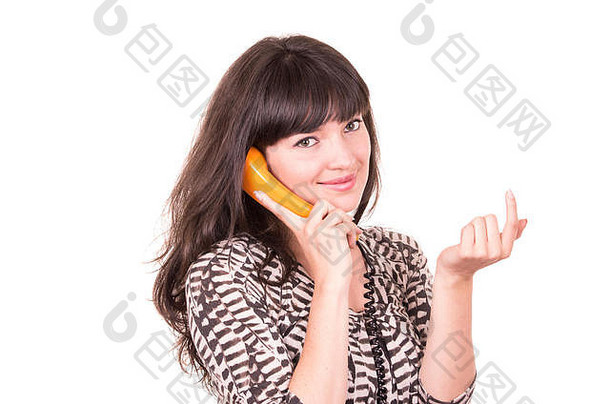 美丽的年轻的女人复古的橙色电话