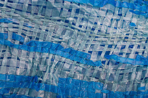macro-photo穿蓝色的便宜的poly-tarpaulin暴露编织塑料织物层压蓝色的低密度聚乙烯低密度聚乙烯