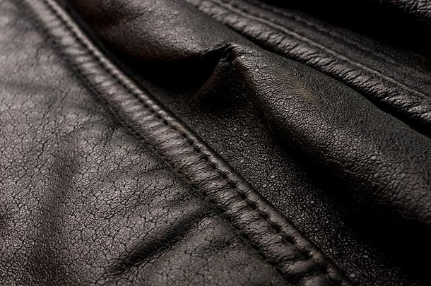 古董真正的软黑色的皮革纹理背景前层毛孔划痕宏特写镜头