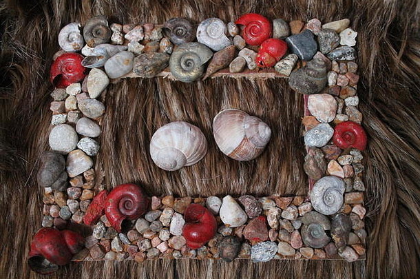 美丽的框架照片鹅卵石螺旋贝壳不错的礼物假期
