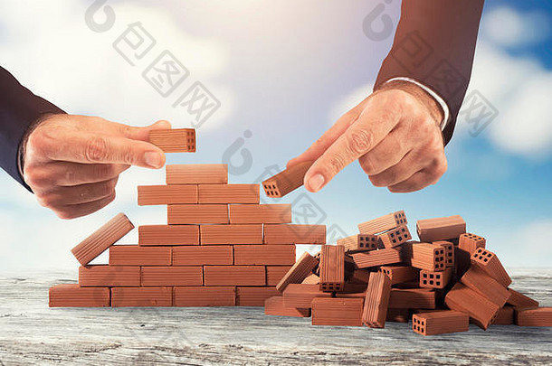 商人把砖构建墙概念业务伙伴关系集成启动